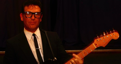 Alan Becks as Buddy Holly