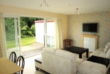 The spacious lounge area with flat screen TV